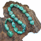 Turq 112   Turquoise spider web nuggets bead strand.