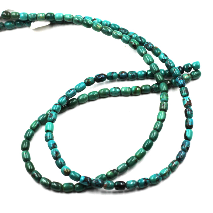 Turq 113   Turquoise barrel shaped bead strand.