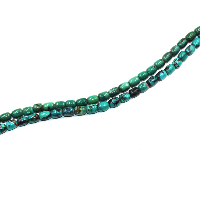 Turq 113   Turquoise barrel shaped bead strand.