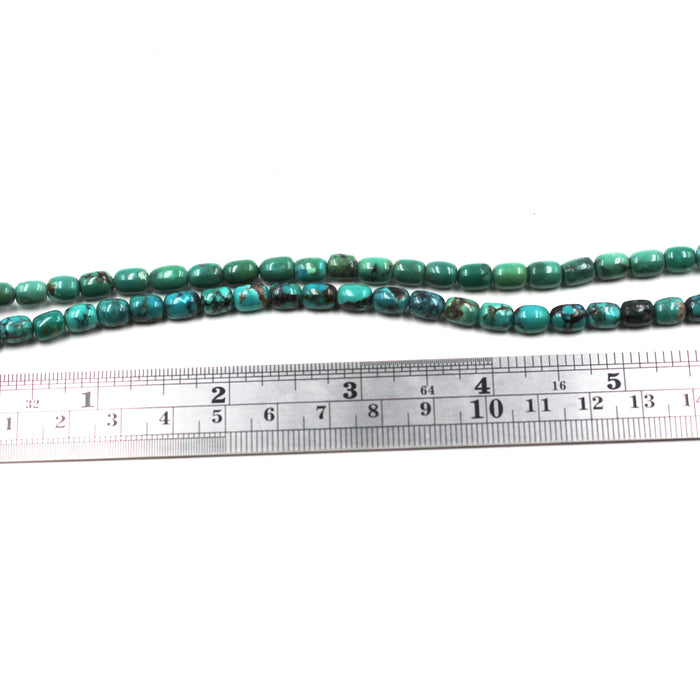 Turq 113   Turquoise barrel shaped bead strand.