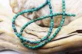 Turq 113   Turquoise barrel shaped bead strand.
