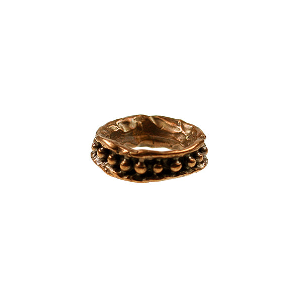 Bronze link with dotted pattern