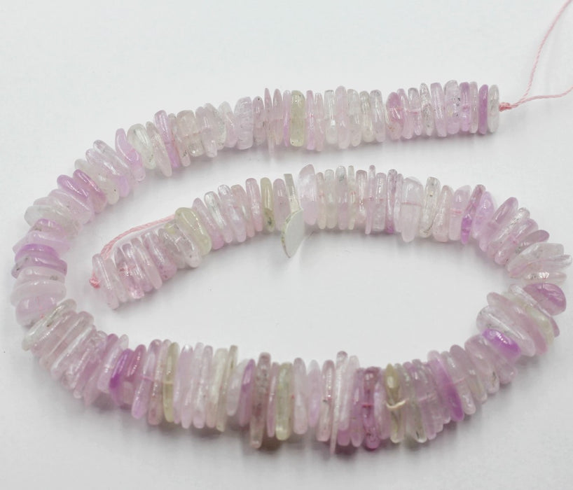 (kunz001)   Graduated strand of Kunzite tumbled slices.