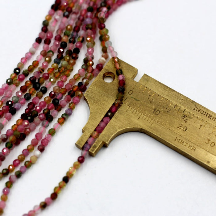 (Tour008)  2 mm round multi faceted multi-color Tourmaline beads.