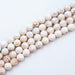  12mm Round Faceted Magnesite Beads