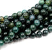 A series of round dark green Moss Agate beads strung together.
